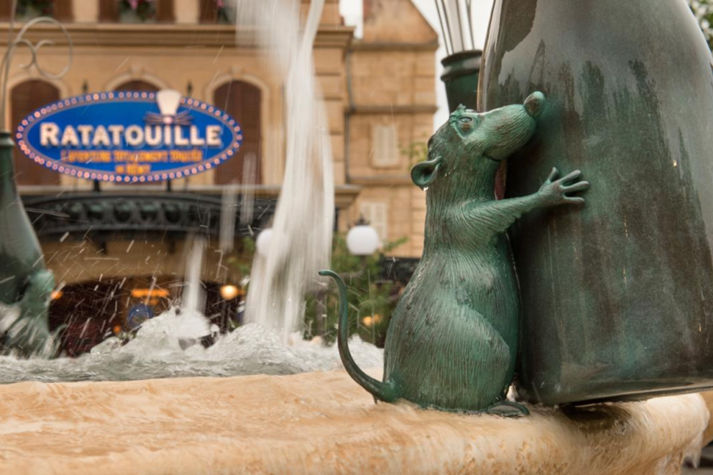 The Ratatouille-themed fountain at Disneyland Paris in front of the Ratatouille: The Adventure ride, a favorite attraction for families.