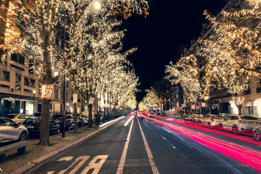 When Is the Best Time to Visit Paris? Avenue Montaigne glowing with festive Christmas lights in winter