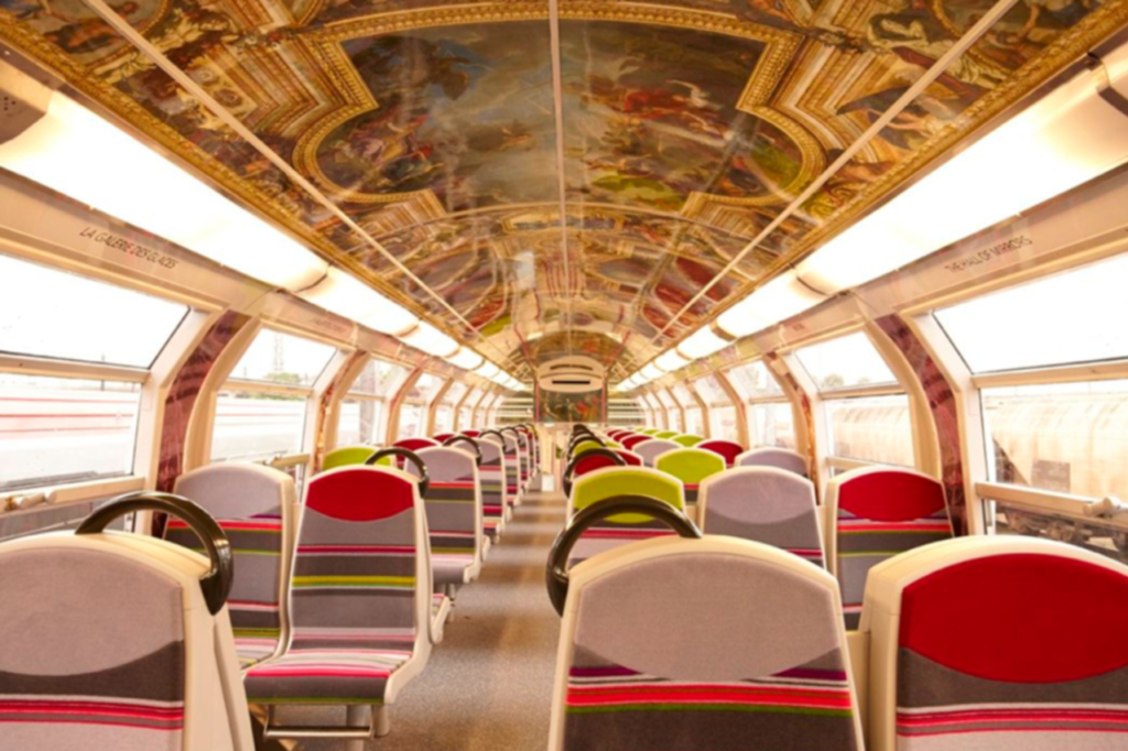 Interior of the RER C train to the Palace of Versailles, featuring artistic ceiling decorations inspired by the palace's grandeur.